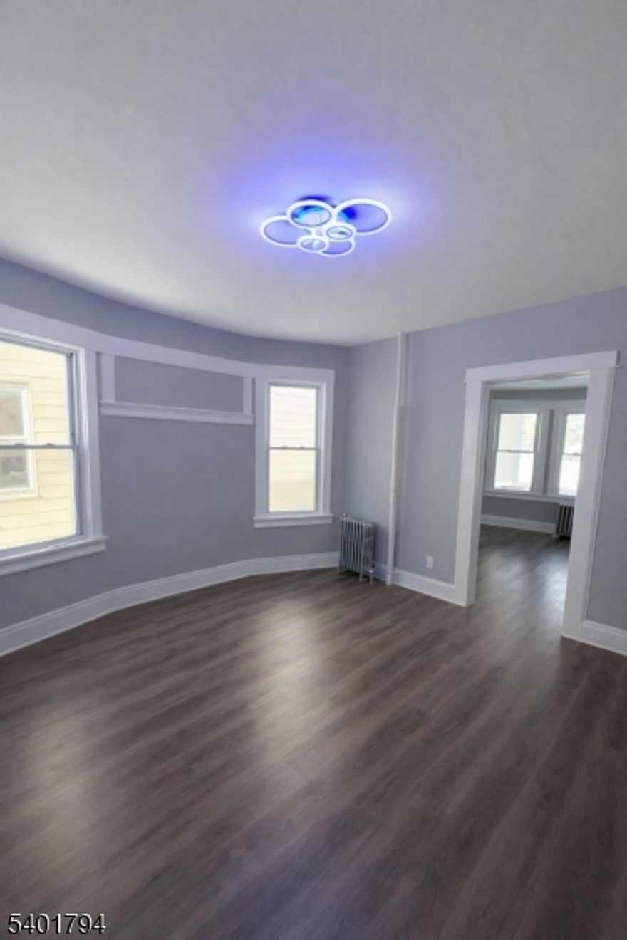 Bright and recently renovated 2nd floor apartment offering 3 bedrooms and 1 bathroom.   This home is filled with natural light and finished with a clean modern aesthetic throughout. Primary bedroom has a double sided closet with lighting.  Enjoy a brand new kitchen with sleek cabinetry and modern finishes. Convenient combo washer and dryer in unit. Parking is included for added ease.  Walking distance to NJ transit, minutes to train station, downtown Newark, and accessible to NYC.