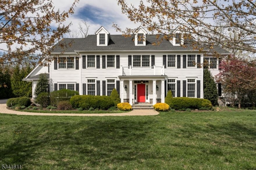 This luxury home at 51 Keystone Court features a grand two-story foyer, hardwood floors, and custom moldings. It boasts a sun-filled living room, an office with porch access, an elegant dining room, and a gourmet kitchen. The family room has a stone fireplace, and a sunroom offers relaxation. A guest suite, mudroom, and powder room are also on the first floor. Upstairs is the primary suite with a luxurious bath, four additional bedrooms, and three bathrooms. A bonus office is on the third floor. The walk-out basement includes a kitchenette with dishwasher, game area, exercise room with sauna, steam shower, and more. 51 keystone is nestled on over 2 acres of land in a quiet cul-de-sac.  s