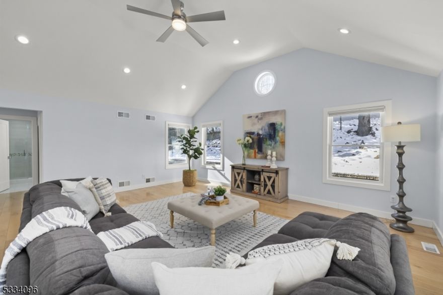 Experience the perfect blend of modern luxury and timeless charm in this beautifully reimagined custom-built home in the prestigious Short Hills. A transformative extension designed by renowned architect Thomas Baio in 2020 unveiled a sun-drenched majestic family-room with 12-foot vaulted ceilings, expansive oversized windows, a versatile home office/playroom, and a luxurious full bathroom all newly constructed. Also, the newly finished basement was added to enhance this magnificent home. With 4 spacious bedrooms, 3 full bathrooms, and an open-concept design, this home is ideal for elegant entertaining and comfortable living. The gourmet kitchen features granite countertops and new stainless steel appliances, seamlessly integrating into the dining and living areas. The inviting living room, anchored by a modern gas-burning fireplace, radiates warmth and sophistication, making it the perfect gathering spot. Outside, the expansive stone patio, upgraded barbecue area, and privacy trees create a serene oasis. Perfectly located near Deerfield Elementary within walking distance, buses to highly rated Millburn Middle School and High School and NJ Transit for easy NYC commutes, and close to Newark Airport, this home offers unmatched convenience. Recent updates include a new refrigerator, stove, garbage disposal, and washer/dryer, ensuring it is move-in ready in all aspects. This exquisite home delivers the ultimate style, comfort, and location for a lifestyle beyond compare.