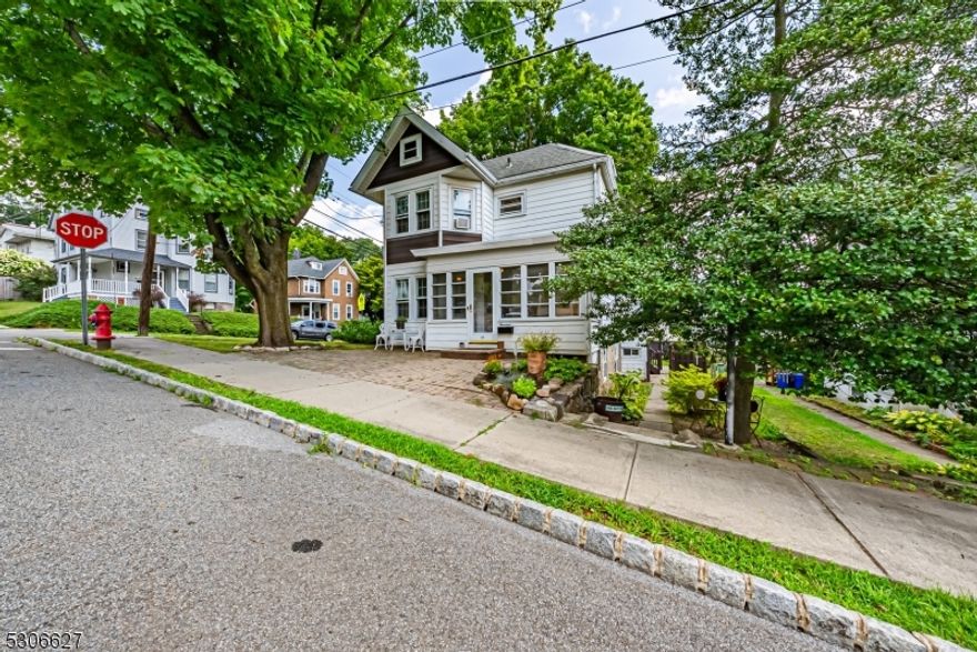 The Charm of a Classic Colonial in Historic Downtown Dover with a few beloved Victorian features. Chestnut woodwork, french doors, glass door knobs & archways are just some of the details to be appreciated in this period beauty.The heart of the home is the stunning living room, light and bright with stunning windows which opens to the formal dining room through a large archway. Spacious kitchen w/tons of cabinet space. Granite counters, 36 inch upper cabinets with molding, mosaic tile backsplash and breakfast nook. This home will be hard to resist. Stunning parquet HW floors. 2nd Level offers 3 generous sized bedrooms & a full bath. Full bsmt, partially finished with walkout access. Basement and attic offers lots of storage. Not to mention the detached garage. Large, fenced in yard Perfect for Entertaining & Relaxation! Front porch, sunroom, screened in porch, deck and patios! Just a few blocks from Dover's Main Street. Easy access to major highways and NYC direct public transportation. Brand new water heater.