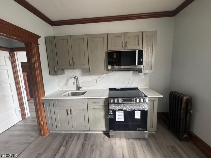 Unit is renovated, New kitchen, Great area, 3 beds.  1 Bathroom, new stove, new floor, new paint. Ready to move in. Near Restaurants and public transportation.