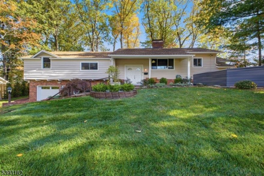 Nestled on a beautifully landscaped property, this spacious and well-loved home in the highly sought after Indian Forest section of Westfield is truly a gem. It's been meticulously maintained & thoughtfully updated throughout! Step inside to find gorgeous, refinished hardwood floors & brand new Anderson FiberX windows (2025) throughout. The remodeled kitchen (2025) is a dream - featuring top of the line appliances, quartz countertops, dimmable LED under-cabinet lighting, an undermount sink & sleek pull-out, self-closing drawers. The home's interior & exterior have been freshly painted in neutral colors & filled with natural light! You'll have plenty of space to entertain in the large living & formal dining rooms, featuring a cozy FP. Elegant French Doors from the dining room lead to an enclosed porch. The primary suite offers a relaxing retreat with a soaking Jacuzzi tub, shower, & walk-in closet complete with custom organizers, French doors lead to an enormous family room, another woodburning fireplace, a fourth bedroom with a private full bath, a kitchenette, & a large laundry room - ideal for guests. Additional highlights include newer HVAC (2022), gutter guards, two crystal chandeliers, three security doorbells, a Rain Bird irrigation system & a backyard gazebo, perfect for relaxing or entertaining. You'll also love the new garage doors and thresholds with automatic openers (2025) as well as a lovely front garden area,patio & fenced yard! Close to both bus & train to NYC!