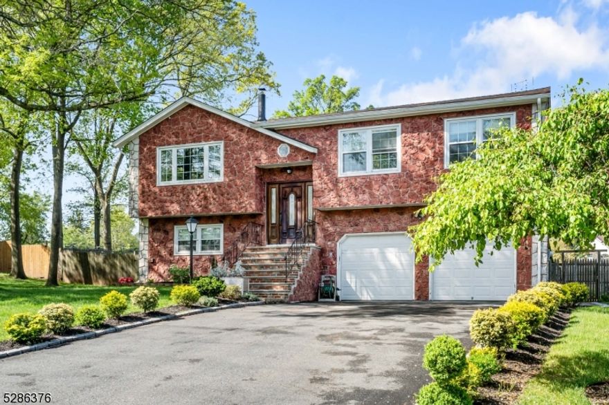 Step into this stunning bi-level home boasting numerous upgrades and modern finishes throughout. Flooded with natural light, this home offers a spacious and inviting atmosphere for both relaxation and entertainment. As you enter, you'll be greeted by a stylish living room with hardwood floors and a wood burning fireplace. Formal dining area and the centerpiece of the home is the beautiful and renovated kitchen, with a spacious center island, where culinary creations come to life amidst sleek countertops and high-end appliances. 3 Spacious bedrooms on main floor with an exquisite, renovated bathroom on main hallway. This home has been meticulously maintained and enhanced with several upgrades over the last 10 years, ensuring both comfort and functionality including newer windows that enhanced natural light and energy efficiency.  The inviting ground level consists of one bedroom, a stunning renovated bath and laundry room. Moreover, an inviting family room with a stone wood-burning fireplace and an incredible great room perfect for gatherings renovated 5 years ago. Access from the great room to the backyard oasis with an inground pool, brick patio and plenty of yard space. Never run out of storage with the two -car garage with additional space.  In addition to these upgrades, the home features a Wi-Fi-controlled sprinkler system that covers the backyard and a portion of the property. Experience the epitome of modern living in this meticulously upgraded bi-level home!