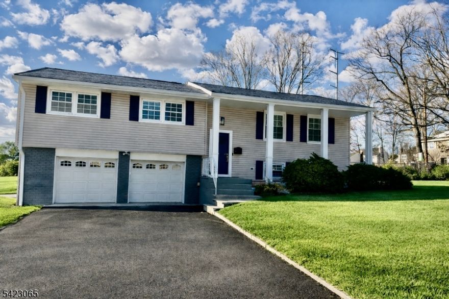 Set on nearly 1/3 of an acre, on a quiet street, this stunning home offers light-filled rooms arranged in a spacious, flowing floor plan. A coastal aesthetic takes center stage in the stylish finishes chosen, including modern lighting, privacy glass-paneled interior doors with brushed gold knobs, and a stunning glass and oak stair railing. Fall in love with the dreamy kitchen equipped with Samsung appliances, a center island with waterfall edges, quartz countertops, tile backsplash, full-height soft-close cabinetry, a pantry closet, and a convenient workstation sink. A wide opening to the dining room makes entertaining and daily meals a breeze. 3 bedrooms and 2 full baths are found on this level, including the spacious primary suite with a walk-in closet and en-suite bath. The versatile lower level offers large spaces to use as you like, including guest space/in-law suite with a full bath with shower and access to the garage and patio. Thermal windows, custom cordless blinds, refinished hardwood floors, a fresh, neutral color palette, ample closet storage, and a laundry room with a utility sink and Samsung 'SmartThings' washer and dryer are a few of the additional updates you'll enjoy. Outside, find a covered front porch, a spacious wood deck, and ample lawn spaces to enjoy. Convenient location with shopping, restaurants, local business centers, Rt. 280 and easy access to NYC with busses and access to midtown direct trains nearby. Taxes are approximately $18,470.