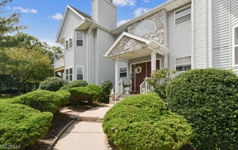 Welcome to this meticulously maintained first-floor end unit, featuring two spacious bedrooms and two full bathrooms. The open-concept living and dining area offers a seamless flow, with an updated kitchen showcasing sleek quartz countertops and brand-new appliances perfect for both entertaining and everyday living. A cozy wood-burning fireplace in the living room provides warmth during colder months, while sliding doors open to a private balcony, offering serene lake views and a peaceful retreat year-round.The primary bedroom includes a generous walk-in closet, and the fully finished basement extends your living space, offering endless possibilities. With a convenient laundry area and abundant storage, this versatile space also features a wet bar with seating ideal for a den, home office, or guest room.This community offers a range of amenities, including a swimming pool, playground, and tennis courts. Its prime location provides easy access to the Dunellen Train Station, major highways, shopping centers, and Rutgers University giving you the convenience and flexibility to enjoy both a quiet retreat and a vibrant lifestyle.