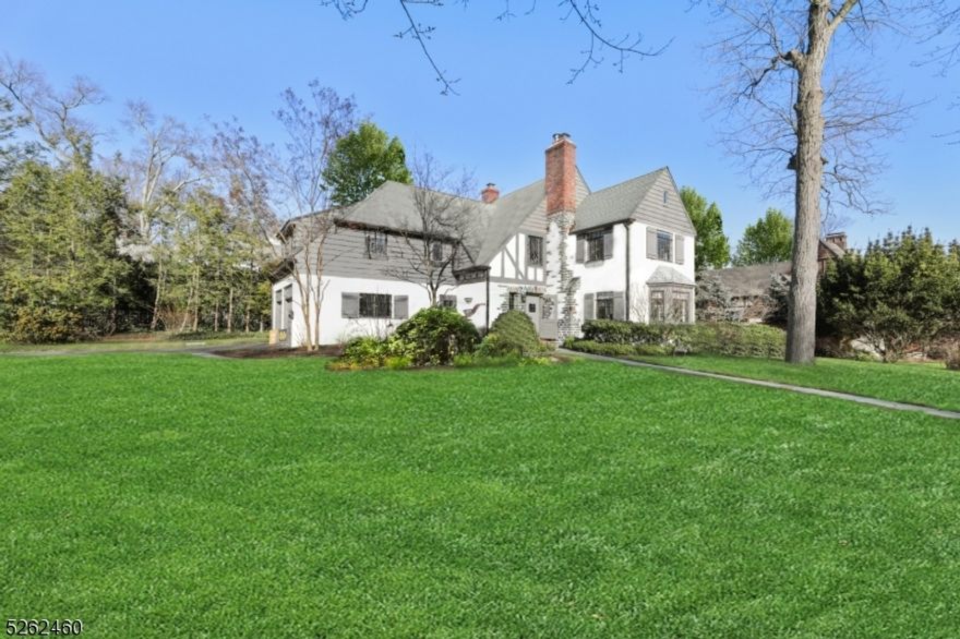 A fresh blend of elegance and timeless architectural treasures combined with today's modern amenities in the stellar Knollwood section of Short Hills ensures that 25 Hawthorne is the ideal home! This stunning 4 Bedroom, 3 Full and 2 Half Bathroom home is set back on a gorgeous lot on a quiet street within minutes to train, town and schools. This expansive turn-key Tudor has been updated top to bottom with a magical curb appeal plus an open and airy floor plan. The first floor features an out-of-this-world Gourmet Kitchen with top of the line stainless steel appliances, large island and built-in banquette that transitions to a dramatic Family Room with vaulted beamed ceilings, limestone fireplace and access to a private patio for al-fresco dining. The sunny Living Room boasts a second stone fireplace and bay window transitioning to the formal Dining Room plus a delightful sunroom / office. The Primary Suite provides 2 huge walk-in closets and a deluxe Full Bathroom. 2nd bedroom features windows on two sides and a spacious walk-in closet. 3rd bedroom provides direct access to the hallway full bathroom with shower over tub. Step down to the large Junior Suite with 3 closets and a private full bathroom with shower over tub. A convenient upstairs Laundry area completes the 2nd level. Lower Level has plenty of space for a Home Office or weekend sleepovers including a Recreation Room, a 31 foot long Game Room, and a Gym / Office / Guest Room with Powder Room.