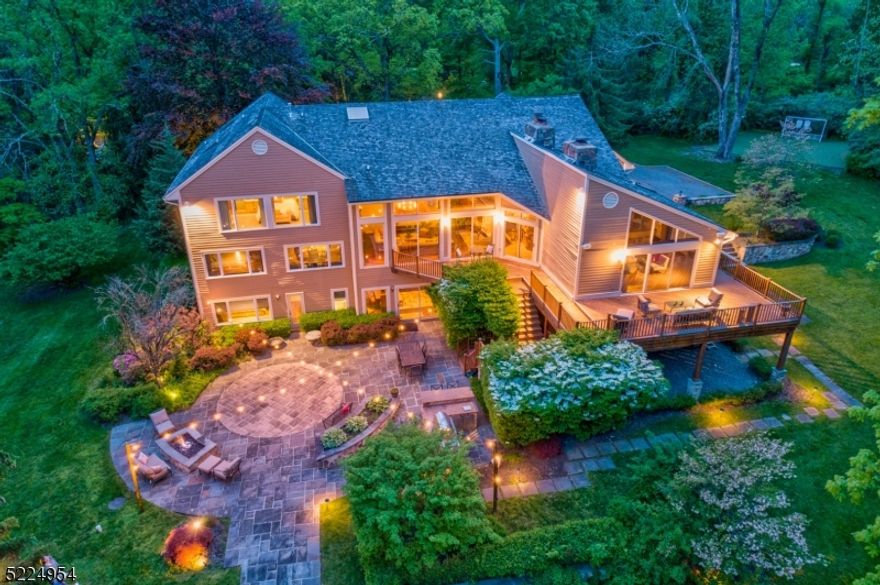 Move right in to this magnificent, 5 Bedroom, 4.1 Bath Contemporary Stunner with soaring ceilings, expansive living space, incredible sunlight and fabulous floor plan for indoor/outdoor entertaining. Situated on over 3 acres of stunning, secluded property. Fantastic outdoor space with a huge Deck, huge Patio, outdoor Kitchen with Bar, Custom Fire Pit, Turf Practice Area and potential room for a pool (town approvals needed) all flowing easily from the home. Beautiful details and updates include Huge Kitchen with island, Viking appliances, Dry Bar, Breakfast Room, 3 fireplaces, Family Room with soaring ceiling opening up to Deck, elegant Dining Room, sunken Living Room with wall of windows and high ceilings. Bedrooms 2 " 4 on the First Level with tremendous closet space and plenty of room to spread out. Second Level Primary Suite with Sitting Room, 2 Walk In Closets, and renovated spa-like Bath. Fabulous Ground Level with Recreation Room, Bedrooms, Full Bath, second Full Kitchen, Exercise Room, Dining Room and plenty of additional space for storage. Main Level Laundry. 3 Car Garage. HOA fees: $500/yr - Covers snow plowing , road maintenance, and exterior entrance. With fantastic schools, easy access to the train and major highways for an easy commute to New York City, proximity to top-notch nature walks and hiking, 18 Sheepfield Farms simply cannot be missed!