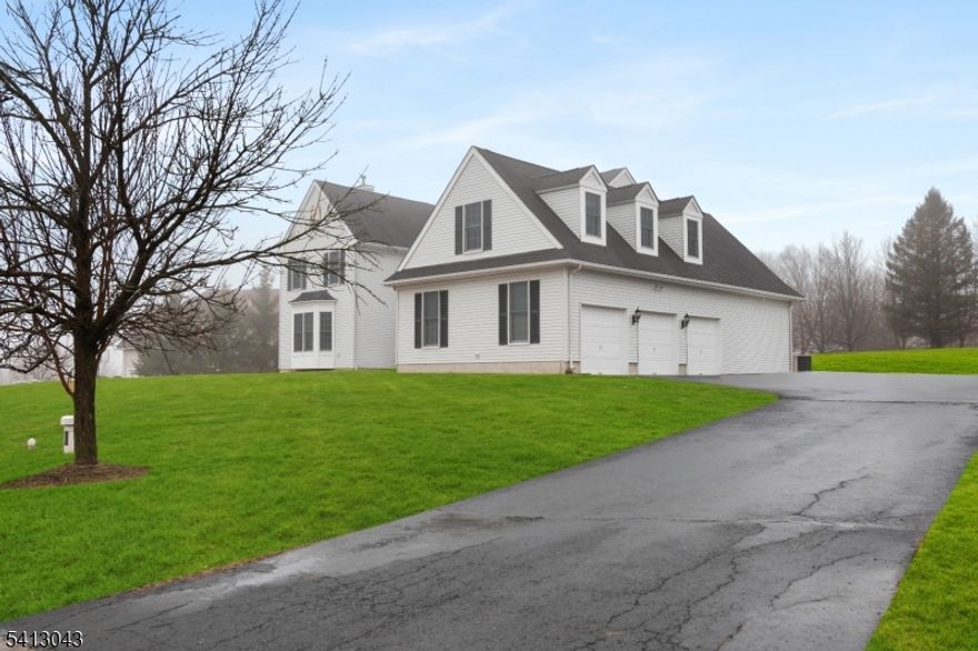 Exquisite 5 bedroom, 5 1/2 bath home in Kentview Estates, Raritan Township in sparkling move in condition.  Situated on a lovely cul de sac. Entry features a covered porch. 3 zone HVAC. 2 story reception foyer. Gleaming hardwoods throughout. 1st floor offers kitchen with center island, granite counters, new refrigerator and dishwasher, along with a double oven. Convenient butler's pantry. Large eating area adjacent to kitchen with a built in desk. Sliding doors exit to small deck and backyard. Family room with vaulted ceiling, ceiling fan and gas fireplace. Large first floor office. Also1st floor laundry room with a sink. 2 staircases to separate 2nd floor sections. Ensuite Master bedroom provides large main room, separate sitting room, large bathroom with double vanity, jetted soaking tub and stall shower. 3 more 2nd floor bedrooms and 2 full baths.. All bedrooms have recessed lighting. .Addl staircase to 2nd floor leads to game room         13' x 33  and full bathroom. 3 full car garage attached. Large unfinished basement (approx 70' x 70' irreg) for your design. Home located on slightly raised mound offers incredible views . Owner is NJ real estate licensee. All for you, the next owner,.  .