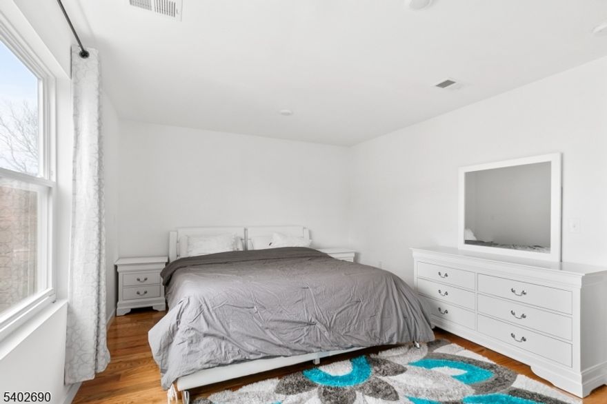 This spacious and modern three-bedroom, two-bathroom apartment offers an open-concept living room that flows seamlessly into the dining and kitchen areas, perfect for relaxing or entertaining. The primary bedroom features a convenient walk-in closet, while the additional bedrooms are bright and versatile. With two beautifully designed full bathrooms and a contemporary kitchen equipped with stylish finishes and ample counter space, this home combines comfort and functionality for an ideal living space.