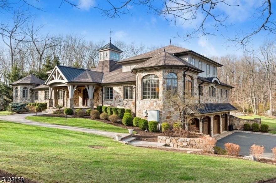 MAGNIFICENT LUXURY ESTATE HOME! EXQUISITE IN EVERY WAY!  ARCHITECTURAL DETAILS THROUGHOUT WITH TOP  QUALITY CRAFTSMANSHIP!  Located at the end of a cul-de-sac nestled on almost 2 acres offering COMPLETE PRIVACY AND RESORT STYLE ACCOMODATIONS. This 5 bdrm. 5.4 baths. 3 levels of living space showcases impeccable attention to details throughout. Spectacular 30x37 Great Rm w/towering cathedral ceilings, exposed wood beams, fireplace, Wall w/floor- to-ceiling windows & French doors that lead to a full length terrace overlooking the stunning backyard. Gourmet kitchen with custom cabinets, oversized 2 level center island, granite counters, Wolf, Miele & Sub Zero appliances, butler pantry and so much more. Luxurious primary bedroom w/fire place, built-ins, plus 2 walk in closets, private balcony w/stunning views, spa like bath w/ dual shower & steam, Jacuzzi Spa Tub, heated towel rack, separate room w/French bidet & toilet, heated floors & hot lamps. 2 laundry rooms, Private Office w/decorative floor-to-ceiling wood design. Stunning lower level w/ new addl. granite kitchen, 2 half baths, Fitness Rm, Game Rm, Family Rm, Media Rm, Elevator service from garage to all levels. Finished lower level opens to the Luxury style-pool w/waterslide, heated jacuzzi spa, new Bronte stone patio. Outdoor stone fireplace, 2 cabanas w/bathroom, shower, changing Rm., washer / dryer. 2- HEPA Air Filtration & Humidifier/Dehumidifier System, Whole House Generator, New Smart Home Tech., Security System.