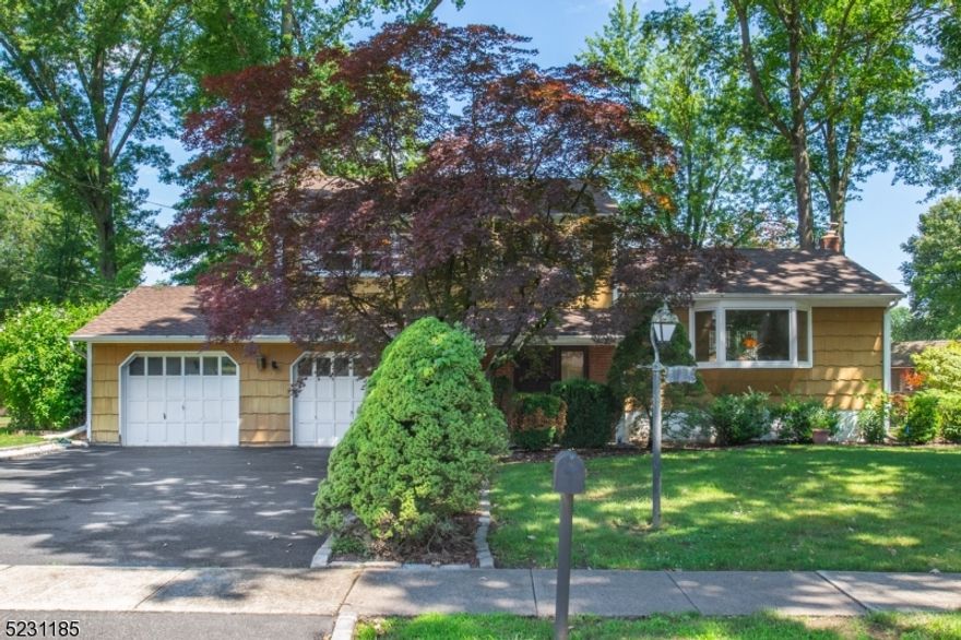 Nestled in the heart of one of the most desirable areas of Parsippany, this 3 bedroom split level has enormous potential!  Seconds to Troy Hills Elementary and minutes to all major Northern NJ arteries, this home is in the perfect location.  Ground level features spacious, welcoming foyer, powder room and garage entrance, family room with stone accent wall and wood burning fireplace, bay window and window seat.  First floor includes eat-in kitchen with access to deck and patio, skylights, recessed lighting, spacious dining and living rooms, both with wall to wall carpeting over hardwood flooring.  Bedroom level offers primary bedroom suite with walk-in closet, full bath with stall shower, two additional bedrooms and main bath with tub shower.  Partial basement includes workshop area, laundry, cedar closet and potential for rec room.  Gorgeous level lot, storage shed, public utilities, central air, attic storage and so much more.  Home is being sold as-is.