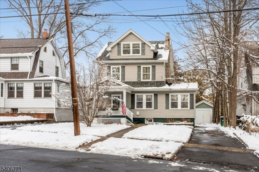 BEAUTIFUL colonial situated in the highly sought after SPRING GARDEN SECTION of Nutley!  First floor features living room with GAS FIREPLACE, den, dining room with picture window for lots of natural sunlight. Updated modern eat-in kitchen with STAINLESS STEEL APPLIANCES including a gas oven/range, microwave, dishwasher, fridge, granite countertops, custom cabinetry and charming built-in butler's pantry.  Kitchen leads to the DECK and LARGE BACKYARD perfect for entertaining and relaxation.  Second floor has two bedrooms and one full bathroom. Wide staircase leads to the third level with a HUGE BONUS ROOM, large closet and storage space. Multiple possibilities for this space including a media/exercise room.  RENOVATED in 2009 with NEW ROOF, WINDOWS, VINYL SIDING, CENTRAL AIR CONDITIONING, and HARDWOOD FLOORS.  Unfinished basement includes utilities, and a workshop area/storage space.  Long, driveway fits about four cars. DETACHED GARAGE.  Located one block from Spring Garden Elementary School. Great sense of community and pride of ownership. Highly rated schools, impressive parks and walking trails for the outdoor lover, and nice downtown area with restaurants/shops. Commuter-friendly town close to major highways and public transportation to New York City (approximately 13 miles to New York City).  Love where you live!