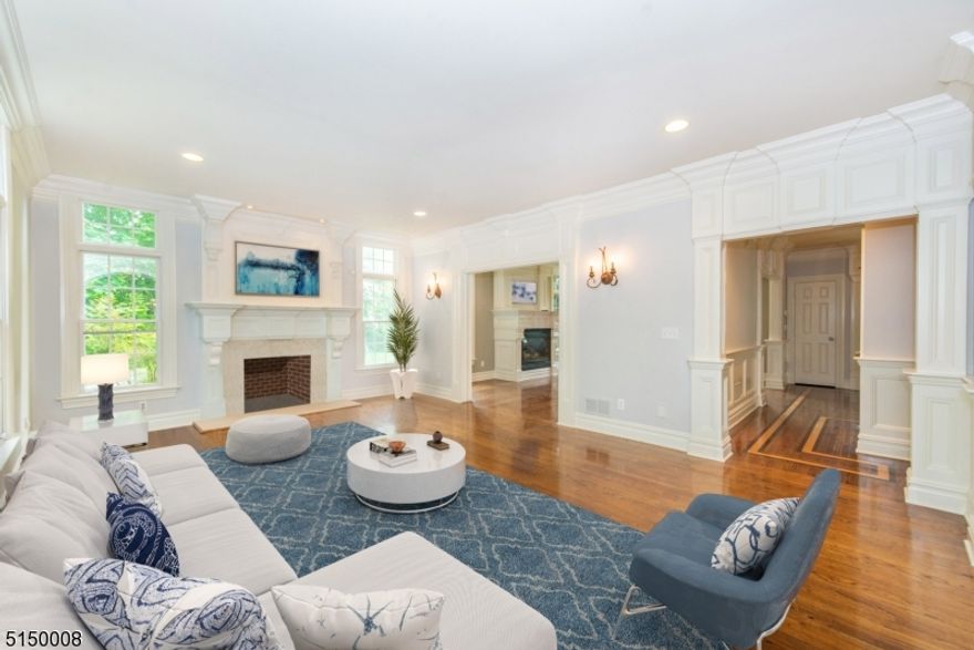 Spectacular Colonial Style Home and Located in the heart of Chatham Township near all schools, parks, and easy walk to Mid Town Directed train ( quick 45-min train ride to NYC). Soaring ceilings and Open floor plan will delight any buyer. 4 floors of finished space provides multiple options for additional entertaining/living/privacy throughout this spacious home. Enter the property via the circular driveway and into the elegant foyer and note the rich molding Details throughout the home. Living Rm features windows to the ceiling and gas fireplace. The Formal Dining Rm is highlighted with exceptional coffered ceilings. The Kitchen opens to the large Fam Rm with 2nd of 3 Fireplaces in home. Enjoy the chic custom Kitchen with Subzero refrigerator, Thermador & Bosch appliances. Walk up the wide turned staircase to the amazing Primary Bedroom Suite with luxurious en-suite bath, sitting area, 2 walk in closets & Fireplace. And, this special home offers His and Her Office Space on the 3rd floor along with Full Bath and common Rm/Also would serve well for live-in or guest rooms. Fun and games continue in the Finished Lower Level with high ceilings, Full Bath, Bonus Rm for live-in help or guests, Wine Room & private entrance. Outdoor space has large deck directly accessible from Kitchen a hard to find .7 acre level lot--- plenty of yard for a variety of outdoor games/activities. Bonus: Whole house generator!