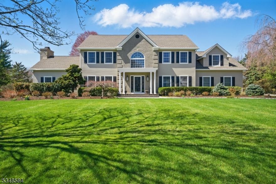 Stately Colonial, Understated Elegance! Prominently set on large, level lot. Bright, open floor plan. Many stunning features throughout. A showcase home! This grand home is accented w/gorgeous architectural details such as moldings & oversized windows. Updated kitchen w/granite & gourmet SS appliances. Cathedral ceilings & floor to ceiling stone fireplace in FR. Formal Dining & LR w/french doors bookend striking 2 story foyer. Entertain with Flair! Extra bdrm/office w/en-suite on 1st floor. Master includes large bath, walk-in closet & personal sitting area. 3 more spacious bdrms. Full BSMT w/high ceilings- bonus living or storage plus over-sized 2 car garage, attic & shed. Glass sliders to trex deck, patio & landscaped backyard oasis w/small pond & garden. Ideal, private location near The Tourne. Hurry!