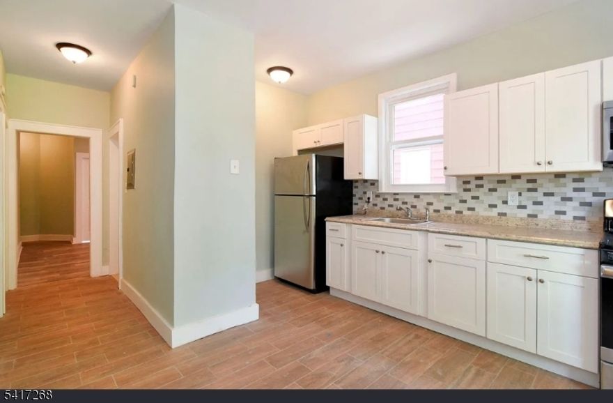 Discover the perfect blend of income potential and convenient living with this impressive six-bedroom, two-bathroom multi-family property. Whether you're a savvy investor seeking steady rental income or looking to live in one unit while the other pays your mortgage, this property checks all the boxes for smart real estate strategy.Step inside to find spacious living areas designed for comfortable everyday life! Each unit offers 3 spacious bedrooms, EIK with stainless steel appliances, granite counter tops, designer white cabinets and modern bathrooms with ceramic tiles. The 2nd floor offers a walk up attic that could be used for a game room, storage, etc.The finished  basement offers valuable additional square footage deal for storage, a home gym, or whatever your imagination can dream up. Outside, the private outdoor space with patio provides a refreshing retreat where residents can unwind after a busy day, host weekend barbecues, or simply enjoy fresh air without leaving home. Weequahic High School is conveniently nearby, while Newark Beth Israel Medical Center provides peace of mind with quality healthcare just around the corner. Daily errands become effortless with Supremo Food Market within easy reach. For commuters, this address is pure gold! The public buses to Newark Penn Station connects you directly to New York City, making the daily trek into Manhattan remarkably stress-free. Newark Liberty International Airport is also conveniently accessible when wanderlust calls