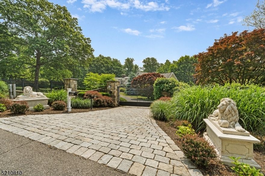 Captivating custom residence; Il Poggio, masterfully articulates impressive craftsmanship with meticulously curated luxury updates and amenities Set on a gated 5 acres of lush gardens, fruit trees, berry bushes,100 year old fig tree, rolling lawns, cottage stone and stucco exterior, four car garage, blue stone patios, walkways and terraces, and classic pool with spa  The gracious interior offers extensive detailed millwork and casework, a relaxed flexible floor plan to ensure a perfect fit, Chef's Kitchen, Dining Room with fireplace, Living Room/Office, Family Room with exposed timber trusses and stone fireplace, Sun Room, first floor Primary suite, private Guest Suite with Living/Dining Room, Kitchen, Bedroom, Full Bath and Juliet balcony overlooking pool and grounds (access from rear corridor level 1), Loft, and a grand walkout lower level with Great Room, Catering Kitchen, Studio, plus a Bonus Room adjacent to luxe bath. French Doors and Window Walls throughout the home seamlessly blend the interior and exterior of this treasure.