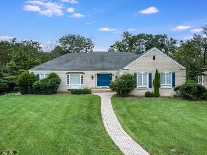 Don't miss this recently updated, lovingly maintained contemporary 5 bedroom, 3.5 bathroom ranch home in the sought-after Short Hills Deerfield neighborhood, sitting on over half an acre level lot. Beautiful front brick facade with new shutters. Open floor plan, perfect for entertaining, featuring luxurious living spaces with cathedral ceilings, three-sided fireplace and sliders to the backyard for indoor/outdoor flow. Newly renovated EIK w/ wood cabinets, stainless steel appliances and granite countertops. First-floor primary bedroom with expansive WIC closet, large primary bathroom with double sinks, new toilet, soaking tub and private access to newly painted deck with new lights. Two more bedrooms and full bath with new shower doors, countertop and toilet are offered on this main level. Updated powder room, new and refinished hardwood floors throughout and custom window treatments. Convenient first-floor laundry room with newer washer and dryer. New light fixture in the office. Finished lower walk-out level with two additional bedrooms, newer full bath, rec room, kitchenette, new LVP floors, enclosed spacious storage area & access to 2 car garage. New chimney flashing, new pipe drains, power-washed exterior and new locks. Repaired/replaced or painted all walls, ceilings, blinds, doors and closets. New HVAC motor and fan, new bolier 2023.