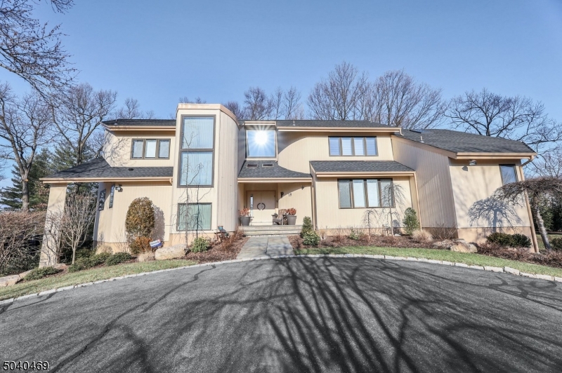 Magnificent custom contemporary home in Forest Park. Meticulously maintained pristine 4 bedroom 4.1 bath home. Soaring ceilings, gleaming hardwood floors, skylights, open floorplan with natural light. Sleek & modern kitchen feat vaulted ceiling s custom marble counter & floors, 2 wolf induction cooking ranges. Custom cabinetry. Center island w/ large eat in area. 2-story great room w/ wood-burning fireplace. Luxurious master bath includes floating vanity backlit mirrors marble floors and showers plus radiant heat in the floors. Separate water closet and custom walk-in closet and more! Close proximity to houses of worship NYC transportation, award-winning schools and shopping. This home is move-in condition truly turn key. Bring your most discriminating buyer they are sure to fall in love.