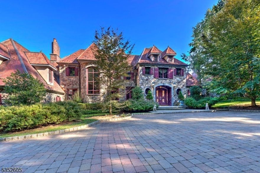 Kestrel Ridge: A home of extraordinary quality and space sits privately on a hillside outside of the village of Pottersville in Chester Township, enjoying the passive recreation benefits of neighboring Hacklebarney Park. A gated entry leads to a courtyard edged by a waterfall and maturely landscaped grounds. The meticulously crafted stone exterior and hand-carved wood features inside lend a European style to the 8055 sq ft home. A 2-story entry hall with domed ceiling opens to an equally inspiring Great Rm with a massive stone fireplace. Occupying one entire end of the first floor, the primary bedroom suite includes an office; BR with fireplace; exercise room; spacious double closet rooms and double full baths. A library/office is nearby. The dining room and kitchen are designed with amenities for a master chef. A breakfast room with fireplace adjoins the stone terrace spanning the back of the home. The 2nd floor is dedicated to 3 secondary BR,2 with fireplaces and all with ensuite baths. Off the back stairs a 3-room apartment provides independent living accommodations. The 3981 sq ft lower level is dedicated to entertainment and recreation with a 22-seat home theater; bar area; media room with fireplace; game room; guest suite, and hobby/wrapping room. Completing the resort-like facilities at Kestrel Ridge: the sequestered pool complex features a Gunite pool with waterfall; stone pool house with kitchen, dining area, laundry, separate bathroom and sauna; and a barbecue area.