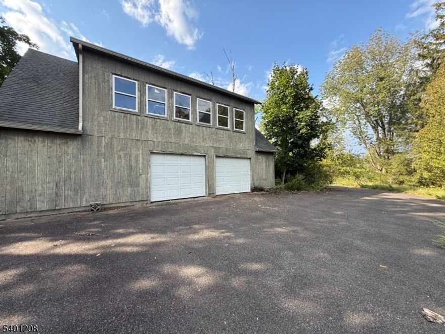 Welcome to the serene retreat of 211 Pickle Rd. A rare opportunity to design and customize a home to your exact vision. This property offers tremendous potential, beginning with an oversized three-car garage a massive structure built in 2002, featuring a full second-story unfinished space ready to be transformed into additional living area, studio, or workshop. All the heavy lifting has already been completed; now it's your turn to bring it to life. In the backyard, you'll find an impressive pole barn built in 2001, equipped with a direct-vent furnace, perfect for hobbyists, storage, or future expansion.  Unfinished basement with potential for additional space. The home itself needs TLC and your personal finishing touches, but the possibilities are limitless. Situated on 1.5 acres, this property offers abundant space for gatherings, outdoor activities, and future improvements.  Utilities are OFF.  Look now further and book a showing today! Whether you're looking to renovate, expand, or create your dream homestead, 211 Pickle Rd provides the perfect canvas to make it happen. Caution: Some floors are uneven/buckled. Watch your step during showings.