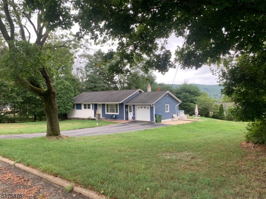 Move in ready ranch on half acre lot.  Above ground pool surrounded by trex decking, updated kitchen w mosaic tile, HW floors throughout, DR w sliders to deck great for entertaining, center island in kitchen, breakfast bar, upgraded ss appliances and granite countertops. The lower level is partially finished and plumbed for second bath, large rec room, laundry area, extra room for storage, work bench, newer radon system installed.  Newer features as well. Close to downtown Hackettstown which has an abundance of dining and shopping, train station and community pool.