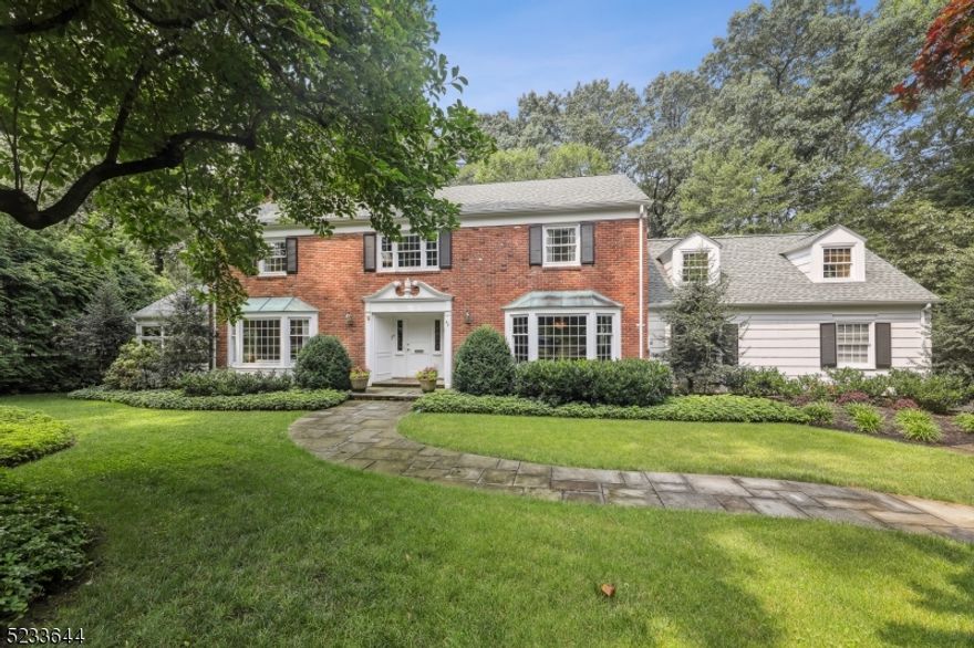 Classic Brick and Wood Shingle Colonial sits on .41acre of manicured grounds. Great location,  close to schools and downtown. Very generous rooms from the three level expansion of the home.Five /Six Bedrooms ,five full baths with a built-in Murphy bed on the lower level.  Gourmet Kitchen with center island with separate eating .High end appliances, desk area ,Mud/Laundry room off the Kitchen.  Indoor/outdoor entertaining leads to a private yard and deck.The  expansion of the home includes an art studio on the lower level.: Fireplaces, Flu and Chimney "as is" with no known defects.Primary bedroom tub jets "as is "