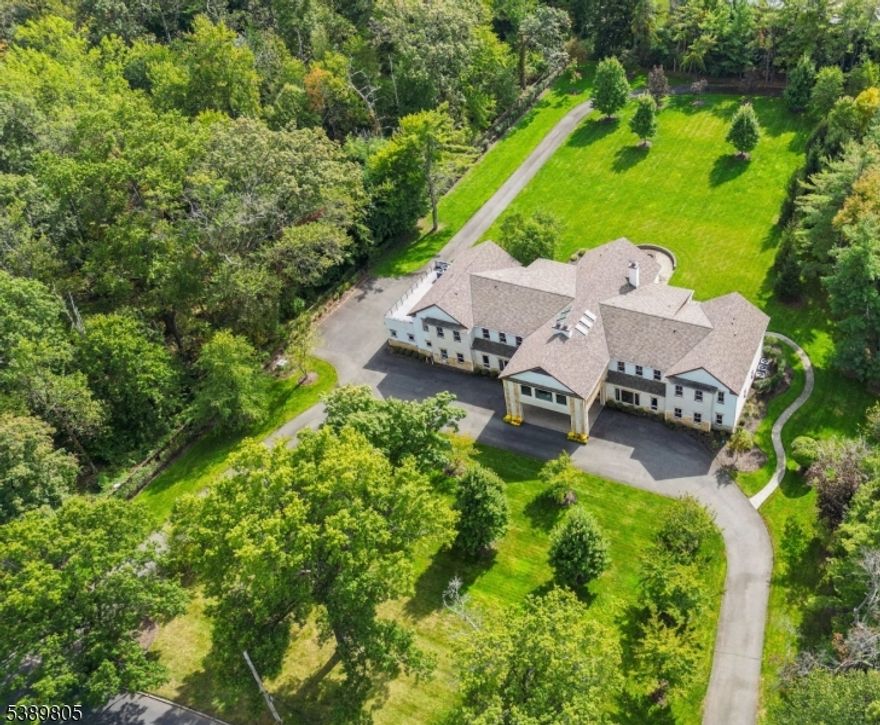 This is the one you've been waiting for! Ideally set on 2.3 stunning acres of totally level property with plenty of room for a pool & tennis court with legal egress to 42 Dorison Drive adjoining the 2000 acre South Mountain Reservation, for the utmost privacy, this spectacular custom built Colonial has been designed for perfect Feng Shui and is south facing w/ great natural light throughout. Designed in 2013 by ARCARI Architects for the most discerning buyer who appreciates luxurious living, this home features radiant heated floors throughout, an elevator to all 3 levels & poured concrete foundation. Your guests will be impressed by the grand 2-story vaulted entrance hall with 6 skylights, Kolbe windows, 10' ceilings on the 1st level, rooms of grand proportion, huge stunning gourmet eat-in kitchen with center island & new top of the line stainless steel appliances, open to family room with fabulous views of expansive property with patio, summer kitchen & fire pit, 2 huge in-law suites & easy 1st level access to attached 3-car heated garage. Has 2 luxurious primary suites with massive custom walk-in closets & spa-like bath w/ double sinks, shower & soaking tub, plus 5 more ensuite bedrooms on the 2nd level. Lower level has walkout access perfect for guests enjoying the property, media room, guest room & rec room. Great amenities including a whole house generator! Bus service provided to highly rated Deerfield Elementary, Washington (5th grade), Millburn Middle & High School.