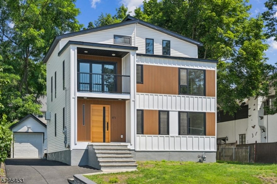 Stunningly renovated 5BR/4.5BA contemporary house in the best location of the best town! This home boasts spacious open floor plan with 17ft high ceiling in family room areas, custom-made contemporary interior with modern hardware, custom closets throughout, all custom made heavy duty thermo-broken aluminum windows and patio doors throughout, double paneled tempered glass filled with argon, tilt and turn windows, family room with fully openable patio doors. The kitchen is complete with high-end Thermador appliances, 36in gas cooktop, 36in  prograde range hood with 1000 CFM, 30 in combination wall oven and microwave set, 24in dishwasher, 10ft long waterfall center island with quartz counters on both sides ,quartz kitchen counters, and quartz backslash. The first floor features a bedroom and a full bath. The 2nd floor is home to a luxurious master suite, 2 additional bedrooms, 1 full baths .The 3rd floor features a large bedroom, a full bathroom, laundry room , a sitting room. Fully finished basement with a rec room and powder room. Must See!!!