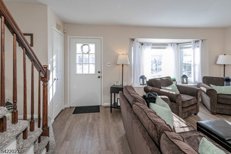 A premier setting in Williamsburg Square in Hillsborough offers effortless access to everything this much-loved community provides. With a pool, tennis courts, and a clubhouse for summer weekends full of outdoor activities and just moments from the restaurants, shops, and movie theater along the Route 206 corridor, this Hillsborough townhouse is an easy, carefree place to call home. A fenced garden and patio provide a charming and private spot to host summer barbecues. Inside, the kitchen and dining area have been beautifully renovated with modern finishes, and the floors have been updated with wide-plank luxury vinyl. The natural light and inviting layout will appeal to anyone searching for a townhome in Hillsborough! A reserved parking spot sits right out the back door, with plenty of guest parking available. Upstairs, two sunny and spacious bedrooms offer generous closets. The primary bedroom connects to the updated hall bathroom, which feels clean-lined and fresh. A convenient powder room near the kitchen welcomes guests. The full basement provides excellent storage, houses the laundry, and offers ample space to finish if that's on your wishlist. A wonderful opportunity for buyers exploring Hillsborough real estate or seeking a low-maintenance townhome in a prime location.