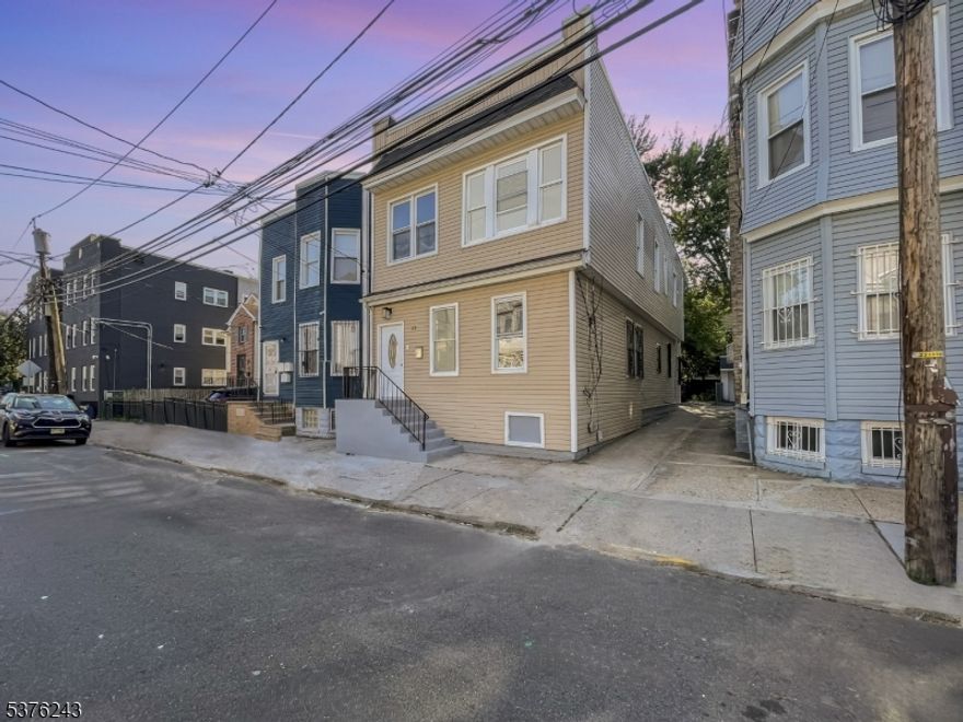 OPPORTUNITY AWAITS! Ideal for both investors and owner-occupants, this expansive two-family home highlights quality modern finishes and amenities throughout. The first floor unit offers 3 bedrooms and 1 full bath and the second floor unit has a 4 bedroom, 1 bath layout. Each apartment includes an inviting, sun-filled living room, modern eat-in kitchen, and washer/dryer hookups for convenient in-unit laundry. Highlights include luxurious flooring, contemporary doors and windows, beautiful plumbing fixtures, and a brand new refrigerator with oven ranges. The basement has separate utilities and offers storage. Both units have entrances in the front and rear of the home for quick access to the street, backyard, and basement. Convenient off-street parking is available behind the house. Located near the East Orange border, the property is blocks from shops and restaurants, close to the Garden State Parkway, and offers a variety of public transportation options. Don't miss this exceptional opportunity to own a move-in-ready, income-generating property in a prime location! Book your showing today!