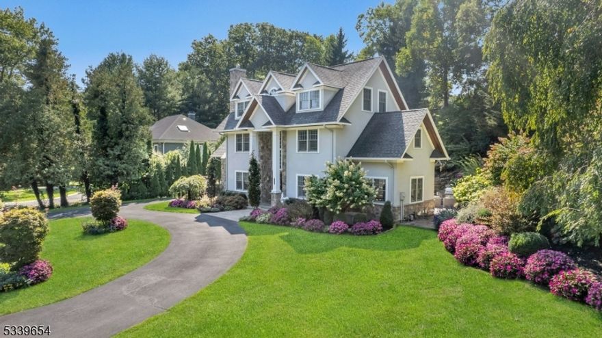 Gorgeous updated custom center hall colonial in sought after Mountain Lakes.