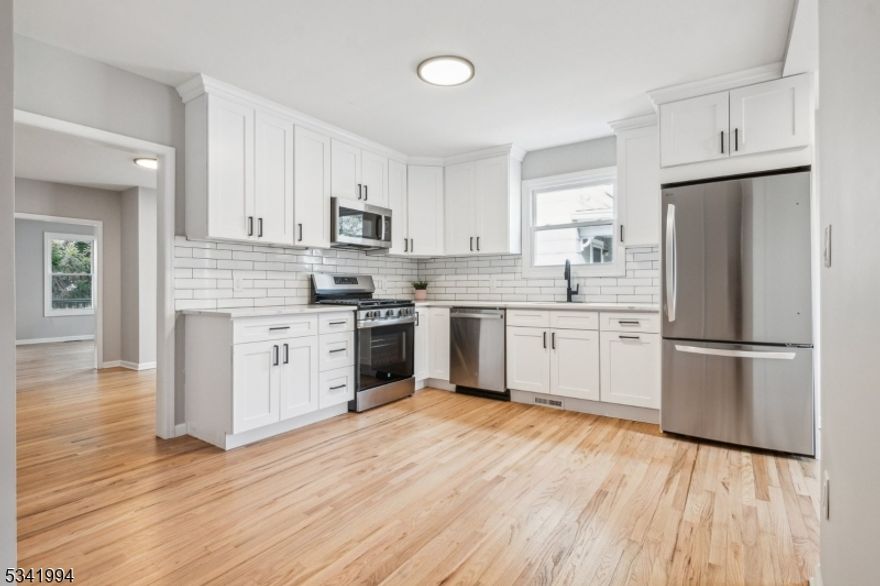 Don't miss this light-filled, fully renovated 3-bedroom, 2-bath home featuring beautiful hardwood floors and a large backyard, all within close proximity to town, schools, and NYC direct trains! Brand-new carpet recently installed giving the home a fresh, move-in-ready feel. The unit includes custom-built closets throughout, a brand-new shoe closet near the entrance (landlord is flexible and happy to remove if preferred), and three floor lamps plus all light fixtures, eliminating the need for immediate setup. Enjoy the convenience of a covered one-car garage delivered vacant, with the option to park inside or directly outside. Exclusive basement storage and private laundry are included and not shared with other tenants, along with use of the lower level. Backyard access is shared, offering additional outdoor space. A truly turnkey rental in an exceptional Chatham location!