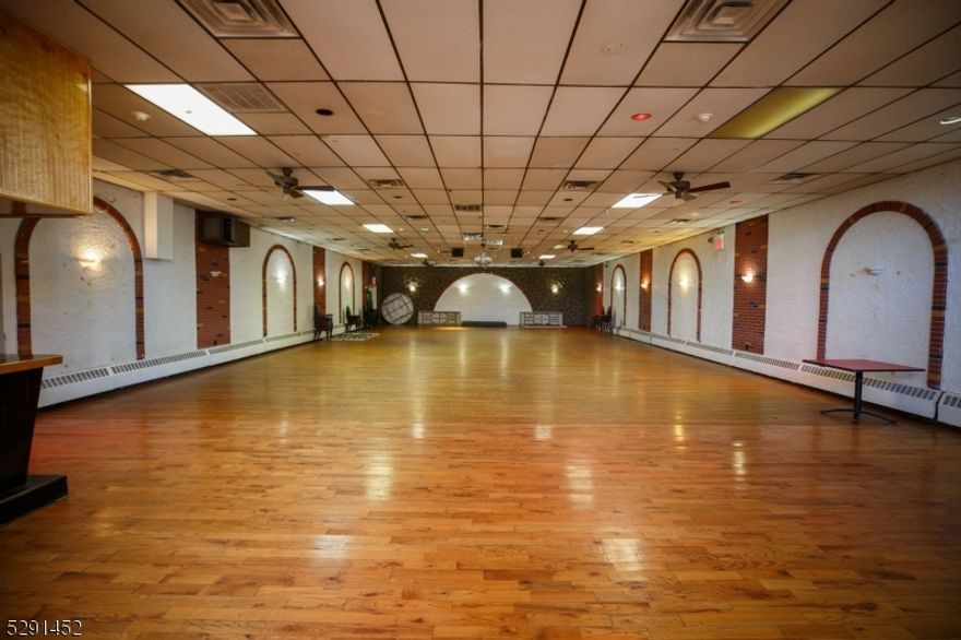 Sales price includes Liquor License. Sale is in as-is-condition. Operating since 1978 as Club Cubano de Elizabeth. Remodeled 1979. Expanded building 1988 added new kitchen, 2 bathrooms, two smaller private rooms, additional storage rooms, 2nd floor bar,  partially finished basement and fixed roof.  Central AC units forced air, kitchen equipment, ice machine, beer coolers, are all in working condition. Added outdoor bar and lounge area. Parking for approximately 20+ cars.