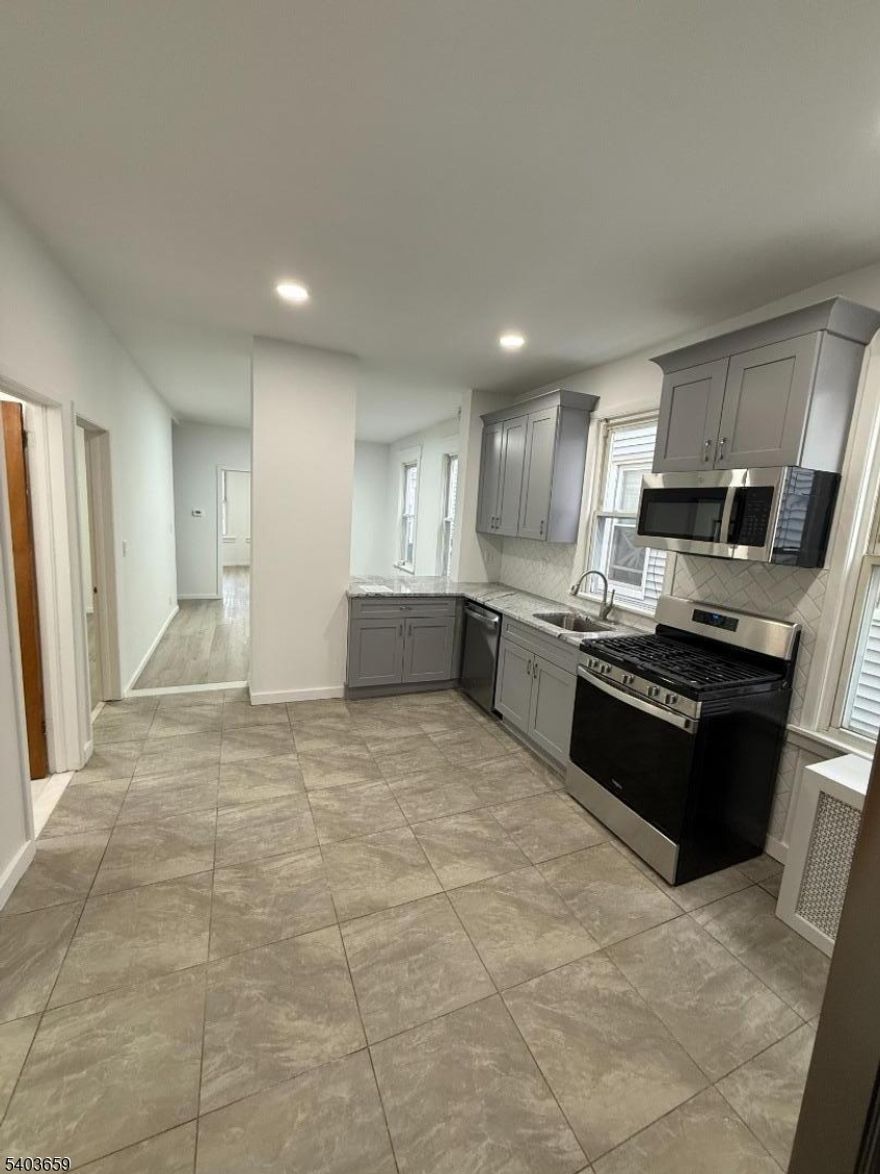 Newly renovated first floor apartment with 3 bedrooms. Dishwasher, microwave, stove, refrigerator all included. Access to the backyard and coin operated laundry in the basement. Great location, within walking distance from train station, parks, bakeries, restaurants, ice cream shop, liquor store. 5 minute drive from Newark airport and Jersey gardens mall.