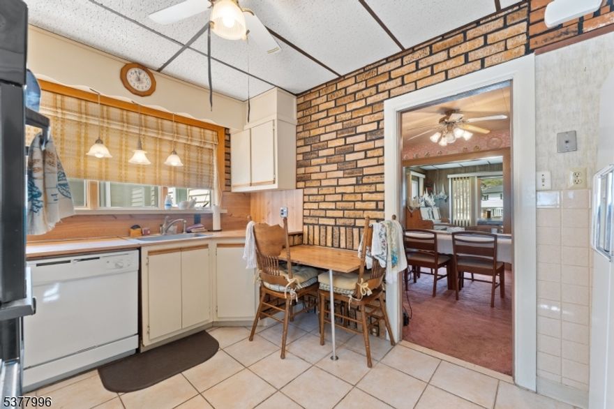 Commuter Delight!  Three blocks to the Garwood train station. Ready for your update preferences. Living room with a gas fireplace. The first floor features a primary suite with full bath and sunroom, while having separate heat & AC! Fixed stairs to access the attic and a full basement, yielding tons of storage space.  Fenced rear yard with garage and shed. Great house with so many options!