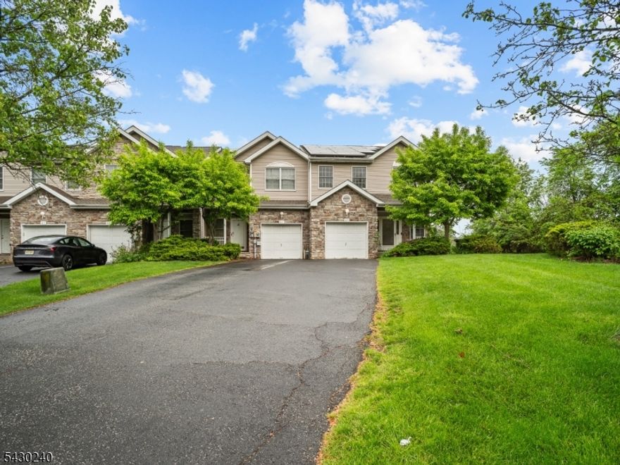 Welcome to this spacious, end-unit townhome located in the highly sought-after Mazdabrook community of Parsippany. This Sycamore model is one of the largest in the community, and stands out with extra living space, generously sized bedrooms, and added privacy. The main level features abundant natural light, hardwood floors, a wood-burning fireplace, and sliding doors that lead to a private walkout deck, offering your own peaceful outdoor escape.The second level features three large bedrooms, anchored by a primary suite complete with an en-suite bathroom, walk-in closet, and abundant storage. The large basement offers ample additional space with endless potential, ideal for a media room, home office, gym, or recreation area. Additional highlights include low HOA fees, an attached one-car garage, a three-car driveway, and ample guest parking nearby. Recently upgraded with a new roof (2025), included solar panels, and a new water heater. Located just minutes from Routes 46, 80, 287,10, and with easy access to NYC-bound public transportation, this home offers the perfect balance of space, privacy, and everyday convenience.