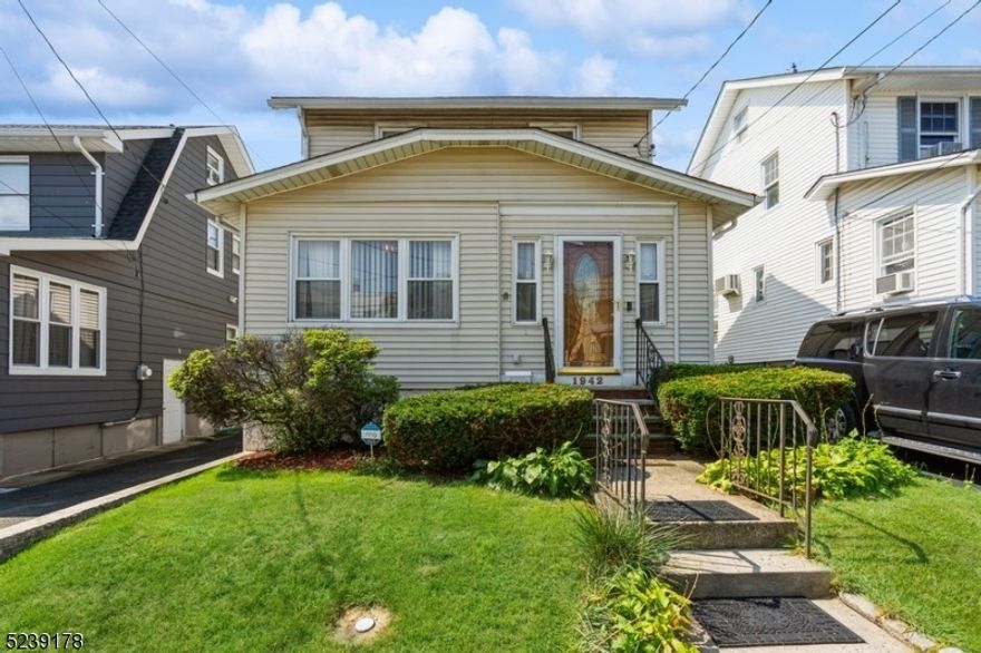 Classic, Cozy Charm in a Unbeateable Location! Well maintained 1930s side hall Colonial with 3 bedrooms and 3 full baths in the heart of Union mere blocks away from endless shopping and dining options on Morris Avenue, as well as schools, parks and golf clubs, and easy access to the Parkway, Rt. 22, I-78 and public transit for effortless commutes. This home boasts many old-world details and character, including hardwood floors, crown molding, rich trim + baseboards, and so much more. The main floor begins with an inviting living room anchored by a brick wood-burning fireplace and flanked by a sitting/tv room and a spacious dining room with lots of space for entertaining. Just beyond is a kitchen equipped with tile flooring stainless steel appliances, and an adjacent full bath with shower. All 3 bedrooms are upstairs, along with a full hall bath with tub/shower combo. Bonus finished space in the walk-up attic can be used as a playroom or office.  The basement level offers a large, bright finished recreation room, as well as third full bath with laundry, separate side entrance, and access to utilities. Sliding doors off the dining room lead to a covered deck perfect for relaxing, with a patio and fully deep fenced-in yard beyond where you can BBQ, sit in the shade, or garden. A detached 1-car garage completes this lovely home.