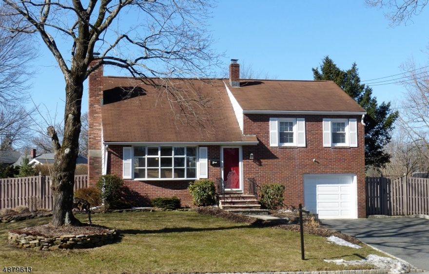 Bright brick split with 3 bedrooms and 2.5 baths, open first floor with doors leading to Treck type deck and great yard. Hardwood floors, Wood burning  Fireplace in living room, opening up to deck and patio. Beautiful kitchen with granite counters. Master bedroom with walk in closet and separate bath. Finished basement with new carpeting and great for that large rec room.  Oversized deep garage with freshly painted floor. Perfect entertaining home with a yard to go with it.