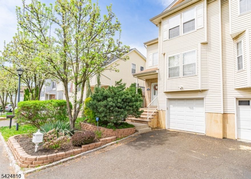 Welcome to this bright and spacious duplex, built in 2000 and RENOVATED beautifully! Flooded with natural light, this inviting home features an entry hall with a convenient coat closet, leading up to the main level with an open-concept living and dining room combo, a powder room, and an over-sized 24' x 11' kitchen with sliding doors that open to a landing and patio within the fenced yard perfect for outdoor entertaining. Upstairs, you'll find a generous 7' x 14' landing, ideal for a home office, complete with a double closet, along with two spacious bedrooms. The lower level features a finished rec room, laundry area, and direct entry to the built-in one-car garage. Enjoy the benefits of fee-simple ownership with no maintenance fees! Ideally located near Union High School and Burnet Middle School, and offering easy access to NYC transportation, Routes 22 & 78, the Garden State Parkway, local shops, and more, this home combines comfort, convenience, and excellent value. Come turn this house into a home before someone else does!