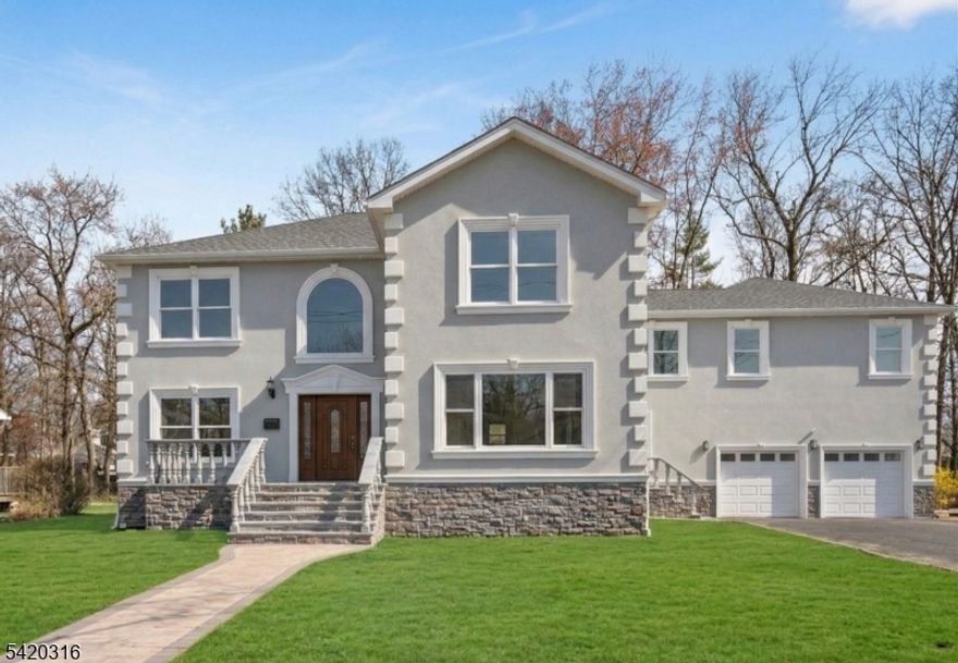 Introducing this newly built 5-bedroom, 4.5-bath Colonial offering 4,460 square feet of thoughtfully designed living space in the highly sought-after Lake Parsippany neighborhood. The exterior features sophisticated stucco accented by elegant stonework and marble detailing, creating timeless curb appeal. Inside, a grand double-height foyer welcomes you into an expansive open floor plan enhanced by high ceilings, recessed lighting, crown molding, and Andersen windows throughout. The gourmet kitchen is a chef's dream, featuring a large center island, stainless steel appliances, a pantry, and a formal dining area that flows into a spacious great room with a cozy fireplace. The functional first floor also includes a bedroom with an en-suite bath, a dedicated prayer/office room, a powder room, and a mudroom. Upstairs, the luxurious primary suite boasts multiple closets, a balcony, and a spa-inspired bath with a large walk-in shower. The second level is completed by three additional bedrooms, a second en-suite, a versatile office or second prayer room, and a convenient laundry room. Additional highlights include a two-car garage, unfinished attic storage, and hardwood flooring. The outdoor space is equally impressive, featuring a new Belgium block driveway for six cars and a backyard with both lawn and concrete patio space, and an upcoming shed.