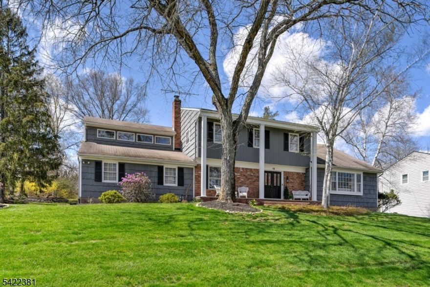 THE ONE YOU'VE BEEN WAITING FOR!  Nested at the top of one of the prettiest cul-de-sac streets in town,this 5 BR colonial sits grandly on .71 acre of treed and private property.  Gracious entry foyer leads to bright spacious living room with gleaming hardwood floors. This opens to formal Dining room with lovely view of the property . Warm and inviting  Fam Rm has Gas brick F/P and sliders to deck.  Remodeled kitchen with lots of cabinetry. Convenient lndy completes  first level and offers another access to yard. Notice crown molding almost everywhere you look, .  The Primary bedroom has suite like  feel, large walk-in closet,  addl closet and linen closet. Enticing primary bath  features stall shower, jetted tub, double vanity with its own dressing table section.   The vaulted ceiling w/skylight and distinctive window offer lovely  view of the tranquil yard.  Four additional generous size BRS and Additional full bath complete the second level.  Hardwood floors in most rooms. Amazing convenience of walk in attic for all your treasures. Bright newly finished leisure room in basement for all ages or parties. Two car garage has loft storage.  Driveway parks lots of cars.  Underground sprinkler system for ease of lawn care.  Golf course, High School and Hospital couple of streets away.  Enjoy just as it is, enlarge or enhance to your desire....all possible here.***  BEST AND FINAL WEDS 4/15  5PM***