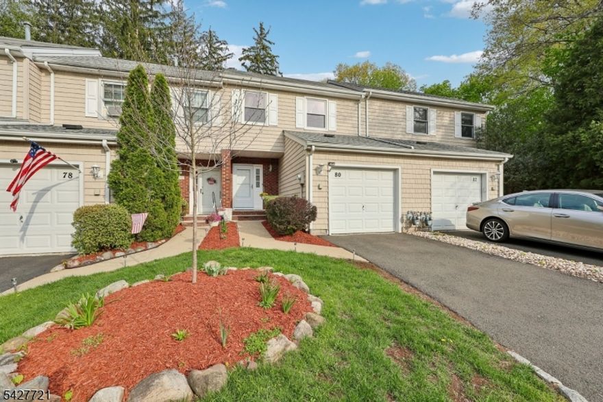 Welcome to this beautifully maintained 2-bedroom, 2.5-bath townhome in the highly desirable community of Heritage Manor. Designed for both comfort and style, the first floor features a recently renovated powder room, a formal dining room, and a well-appointed kitchen with sliding glass doors that lead to a private deck perfect for outdoor dining or relaxing. The sunken living room offers a warm and inviting atmosphere, complete with a cozy gas fireplace. Upstairs, you'll find two spacious bedrooms, each with its own full bath and generous closet space, providing ideal privacy and convenience. The finished basement adds valuable living space, perfect for a recreation room, family room, or home office. Additional highlights include a laundry room conveniently located off the kitchen and direct access to the attached one-car garage. Residents enjoy fantastic community amenities including a pool, indoor tennis courts, and a multi-use sports court.  NYC commuting has never been easier; the bus stop is steps away from your door. Wayne has so much to offer with shopping, restaurants and a top-rated school system. A perfect blend of location, lifestyle, and low-maintenance living this is one you won't want to miss!