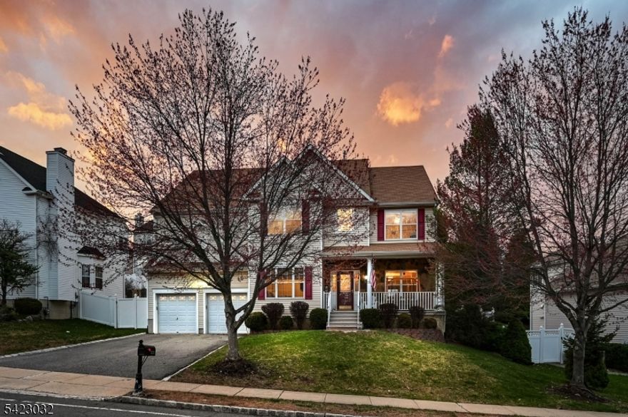 The ever-popular Meridian model is one of the most desirable homes in The Peaks, with only a limited number ever built making this a truly rare opportunity. A standout feature is the highly sought-after FIRST FLOOR BEDROOM, complete with a large closet and access to a 1st Floor Full Bathroom, offering exceptional flexibility for guests, or a private home office. Beautifully maintained and truly move-in ready, this home welcomes you with a charming front porch and a spacious, thoughtfully designed layout. Inside, gleaming hardwood flooring flows seamlessly from the foyer through the main living areas and into the kitchen. The kitchen is both functional and inviting, featuring maple cabinetry, granite countertops, a built-in desk, and a sun-filled breakfast area overlooking the dramatic two-story family room; Soaring ceilings, clerestory windows, a secondary staircase, and a striking floor-to-ceiling stone fireplace create a stunning focal point. Sliding doors off the dining area lead to a patio and fenced-in backyard - perfect for outdoor dining and entertaining. Upstairs, the primary suite offers dual walk-in closets and a spacious en suite bath, while the additional bedrooms and bathrooms are all generously sized. A convenient second-floor laundry room enhances everyday living. The partially finished basement adds valuable bonus space, including a MEDIA ROOM, along with ample storage. Nicely landscaped, patio, and fenced yard.