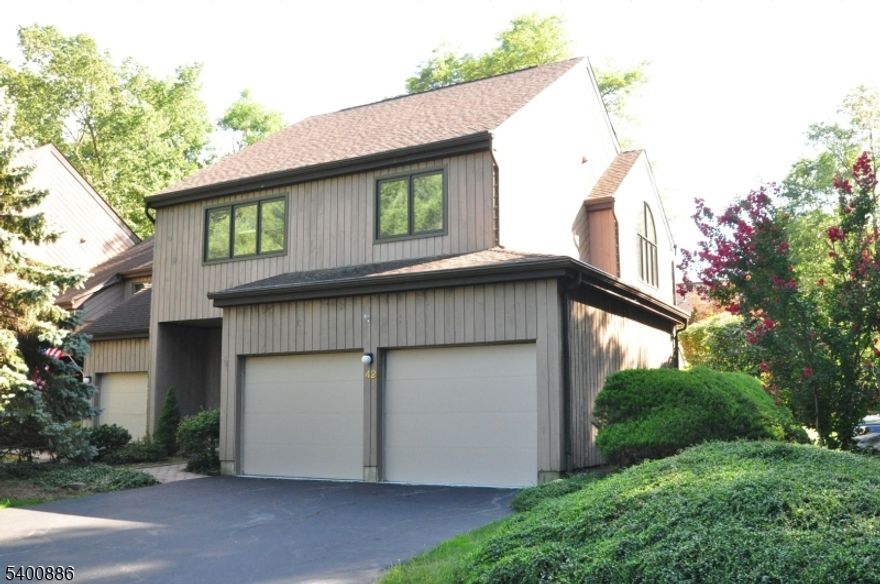 Charming 3-bedroom, 2.1 bath end-unit townhome filled with natural light. Enjoy hardwood floors, vaulted ceilings, skylights, and a dramatic two story living room with fireplace. One of the largest homes in the community, offering exceptional closet space, a 2 car garage with abundant storage, and a convenient 2nd floor washer/dryer. Community pool included. An easy, scenic walk through the park brings you right into town. Live maintenance free and enjoy everything Morristown has to offer. With a private side driveway. This end unit truly lives like a single-family home.