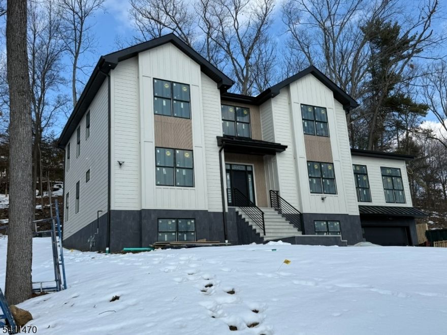 Gorgeous New Construction on a Quiet Dead-End Street!Welcome to this stunning 4-bedroom, 5-bathroom home offering approximately 4,600 square feet of living space. Thoughtfully designed with a modern open-concept layout, this home features soaring first-floor ceilings, sun-filled interiors, and premium finishes throughout blending elegance with everyday comfort.A dramatic two-story foyer welcomes you upon entry. The first floor boasts a spectacular grand room with 12-foot ceilings, a spacious living/family room, a formal dining room, and a powder room.The eat-in kitchen is truly the heart of the home, showcasing custom cabinetry, double wall ovens, stainless steel appliances, a large center island, and a generous pantry perfect for both daily living and entertaining.Also on the first floor is a bedroom with a full bathroom, ideal for guests.The second floor features an expansive primary suite complete with a beautifully appointed primary bathroom and a large walk-in closet. Two additional bedrooms each offer their own private bathrooms, providing comfort and privacy. A convenient second-floor laundry room adds everyday practicality.Additional highlights include a walk-out basement, a two-car garage located on the lower level, and a nicely sized patio perfect for outdoor entertaining and relaxation.This exceptional home combines modern luxury with functional design perfectly situated on a peaceful dead-end street.