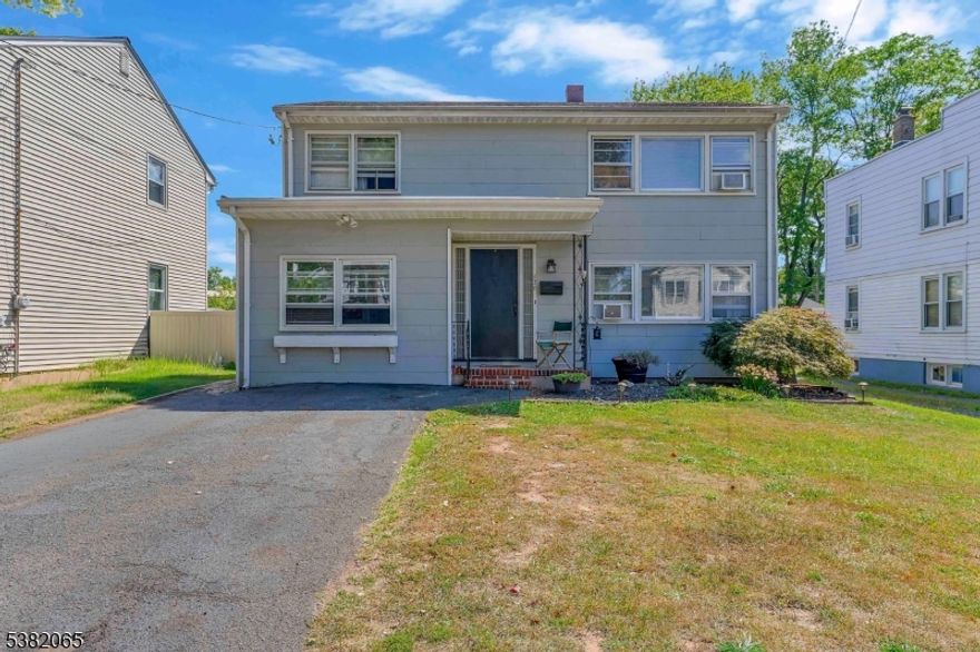 Spacious Colonial featuring 4 bedrooms and 2 full baths.  Enter into the foyer which is open to the L-Shaped Living room and dining room with hardwood flooring and large windows brining in lots of natural light.  The 19 ft kitchen offers a lot of cabinet and counter space, there is a gas range/oven plus a wall oven, double pantry and large eating area. The garage was converted into a family room, The 2nd level features 4 bedrooms, a generous sized Primary and  full bath  in the hall., all with hardwood floors.  The basement is finished with second family room 19x11 and full bath. The property is 150' deep, covered patio,  creating plenty of entertaining space.  With a few personal touches this could be your dream home!