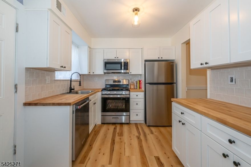 Welcome to this sun-filled, recently updated home in the desirable Warren Village community. This move-in ready, *1242 sq ft home features a beautifully renovated eat-in kitchen (2024) with new cabinetry, stainless steel appliances, backsplash, and flooring. The open-concept living and dining area showcases new flooring (2024) and offers a bright, welcoming space perfect for everyday living and entertaining. Upstairs, you'll find a spacious primary bedroom, a generously sized second bedroom, and a full bath, all complemented by ample closet space. Additional updates include updated lighting, all new doors, molding, and electrical switches and new roof installed April 2026! The partially finished basement provides flexible bonus space ideal for a home office, gym, or recreation room, along with a large laundry area and additional storage. Step outside to your private fenced patio, perfect for morning coffee, outdoor grilling, or relaxing evenings. Assigned parking is located in the rear, with plenty of guest parking available. Community amenities include a pool, playground, and walking path. Conveniently located near shopping, dining, and public transportation, with Donaldson Farms just a short walk away for fresh produce, local favorites, and seasonal attractions. Come see this beautiful and inviting home! * Per NJ Tax Records