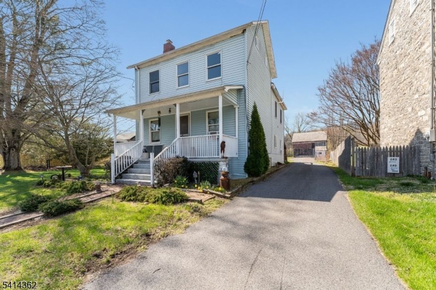 Classic two-story home offering flexibility, potential, and an opportunity to build equity. The first floor is comfortably finished and features two bedrooms along with an updated full bath ideal for immediate occupancy while you plan your next steps.  The second floor, accessible via both interior stairs and a private rear entrance from the deck is ready for completion. Subflooring is already installed, and rough plumbing is in place for a second bathroom, providing a strong head start for renovation. Previously used as a two-family home (zoned single-family), the layout offers excellent versatility for expanded living space, a private guest suite, or creative use tailored to your needs. Live comfortably on the main level while completing the upper floor at your own pace and adding significant value along the way. With vision and finishing touches, this property can truly shine. Additional highlights include a septic system replaced approximately 10 years ago, a high-efficiency System 2000 oil-fired boiler (just 2-3 years old), and an oil tank located in the basement. A detached garage/barn provides ample storage or workshop space with a full second level for even more storage. Enjoy vineyard views! Property is being conveyed in as-is condition.  NOTE: SELLER NOW PLANS ON COMPLETING WALL COVERINGS, INSTALLING VANITY AND TOILET AND FLOORING IN BATHROOM ON SECOND LEVEL. WORK TO BE COMPLETED BY MAY 18. OR IF YOU PREFER, CASH OR RENO LOAN TO DO YOURSELF. Cameras on site.