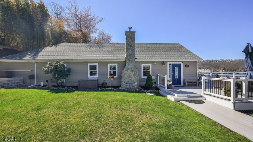 Set on the sparkling shores of Lake Hopatcong, one of NJ's most vibrant lake communities, this home is pure magic. The views? Breathtaking. Sunrise to sunset, the lake steals the show you may never want to leave. Step inside and it just feels right. High ceilings, beautiful floors, and an easy, open flow make daily living simple. The updated kitchen shines with tons of cabinets, warm butcher block counters, a mosaic tile backsplash, a large granite breakfast bar, plus a double oven and cooktop perfect for coffee, meals, and gatherings. With 4 bedrooms and 2 updated baths, there's room for all. The main bath features built-in cabinets and a full-size stackable washer/dryer so convenient. The primary bedroom offers its own full bath and a walk-in closet for a private retreat. The loft? A true wow. A rec area with a bridge leads to an office, all overlooking the lake work just got better. The family room adds warmth with a wood-burning stove and stone surround cozy, inviting, and perfect for relaxing nights in. Outside, a wraparound composite deck delivers sweeping views ideal for relaxing or entertaining. Grassy areas offer a firepit, space to play, and steps to the lake with access to a jet ski ramp. Lots of updates: furnace, built-in heat/AC unit, vinyl wood floors ('25), roof/siding ('21), baths ('20), plus a new driveway ('25) that fits 7 cars. With lake access, low taxes, and easy routes to 80, 46, and 10, you're about an hour to NYC. Unpack, unwind, and enjoy lake life!