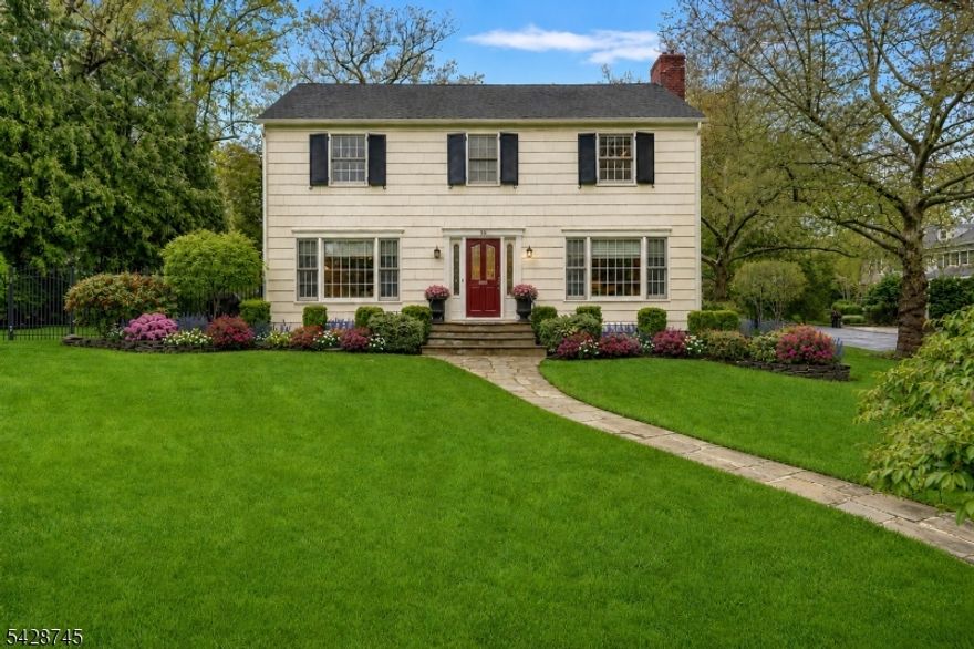 Gracefully set on a beautiful property in the Hartshorn section of Short Hills, this classic Center Hall Colonial blends timeless design with a warm, inviting feel. A gracious foyer introduces well-proportioned formal living and dining rooms, offering an elegant backdrop for gatherings both large and small. The sunlit eat-in kitchen is crisp and thoughtfully arranged, opening to a comfortable family room that serves as the heart of the home. A powder room completes the main level.Upstairs, four generously sized bedrooms are paired with three full baths, including a spacious primary suite. Each room offers excellent scale, natural light, and a sense of comfort and privacy.The finished lower level provides additional flexibility with a recreation room and half bath well-suited for media, fitness, or play.Outdoors, a fenced yard and charming brick patio create a private setting for dining, relaxing, and enjoying the seasons. A two-car attached garage completes this well-appointed offering.